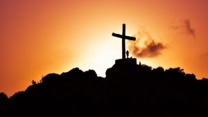 Cross on mountain at dusk
